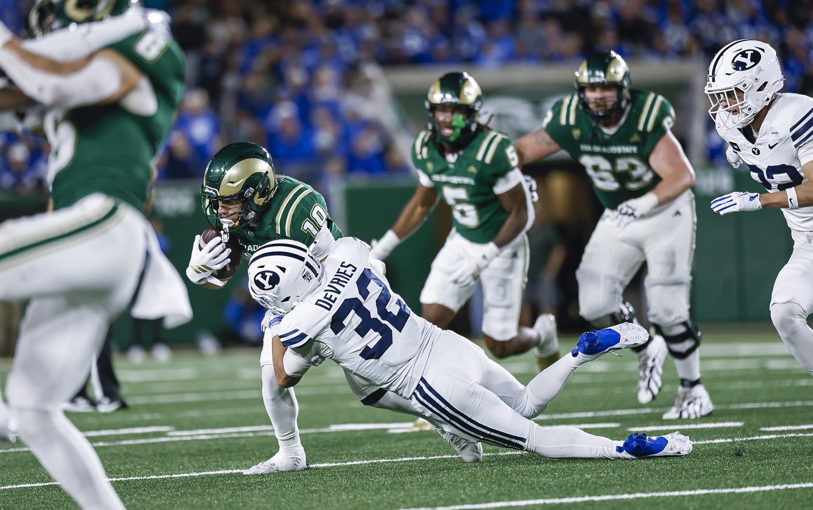 BYU defender making a diving tackle against Colorado State