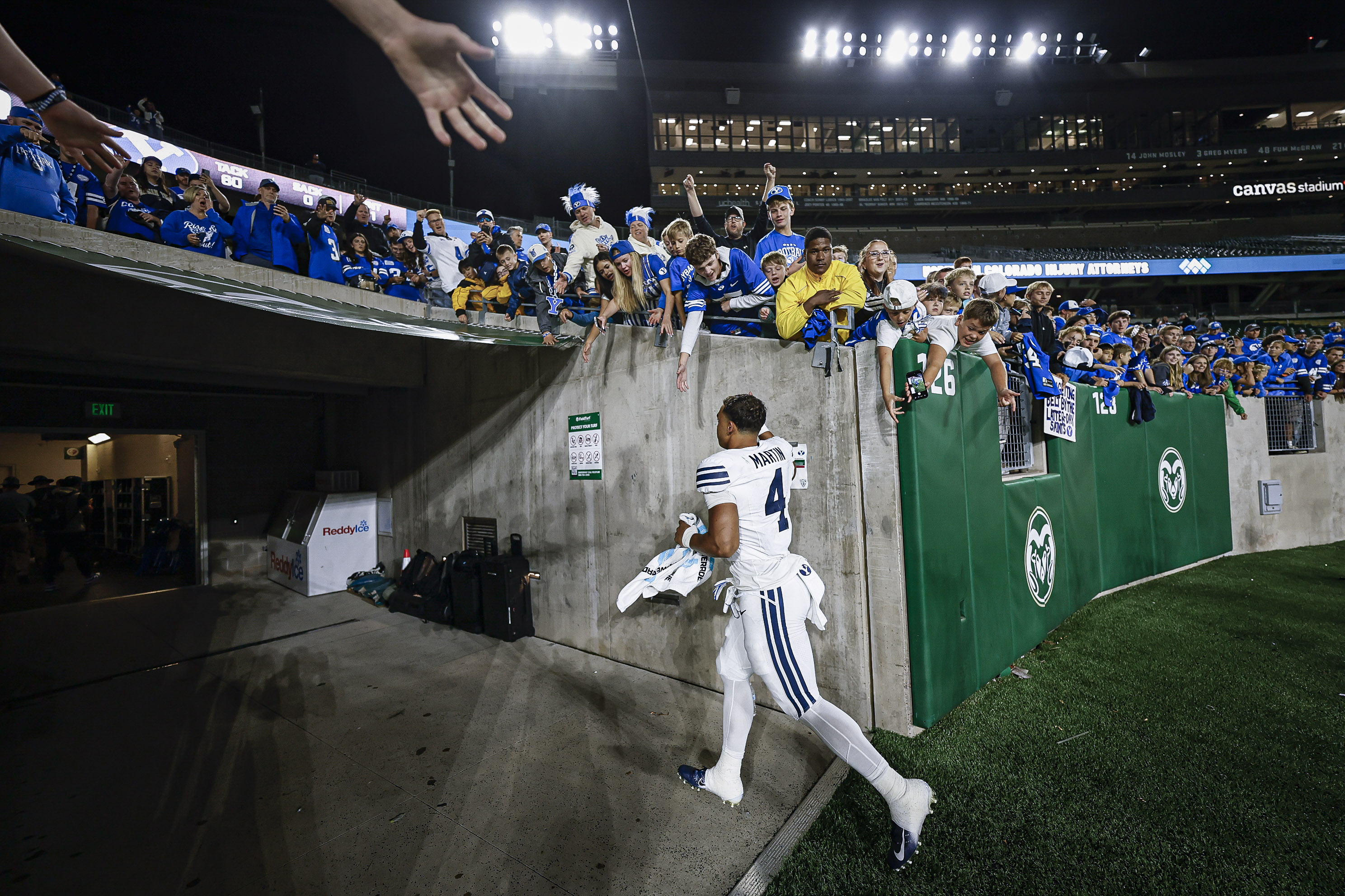 BYU running back LJ Martin running toward fans after a play